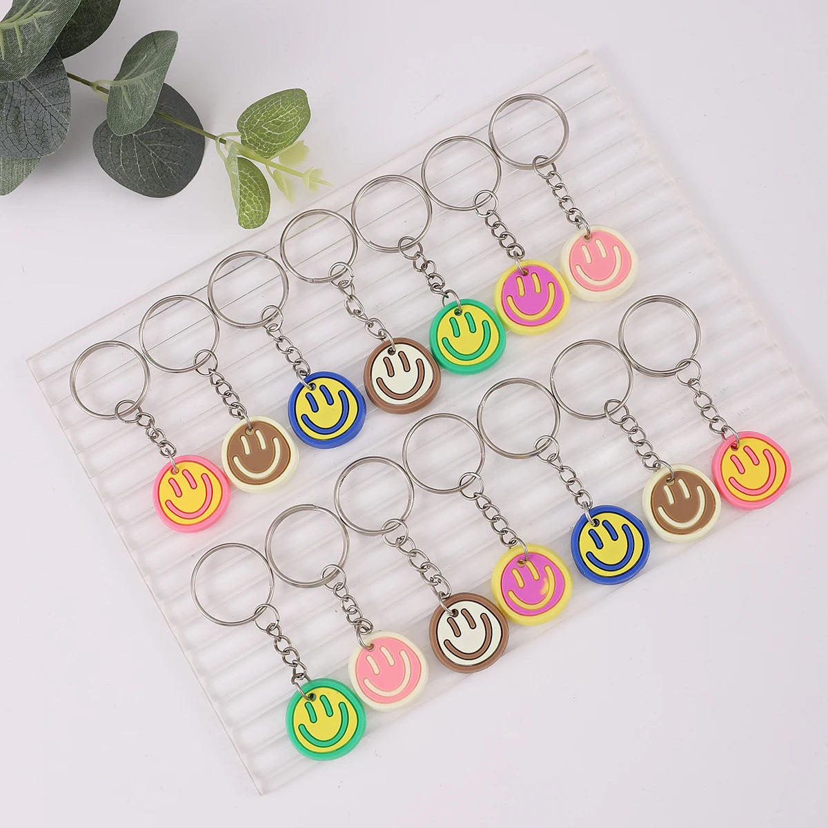 14pcs Cartoon Smile Face Keychain Set – Cute PVC Charms for Bags, Keys & Party Favors